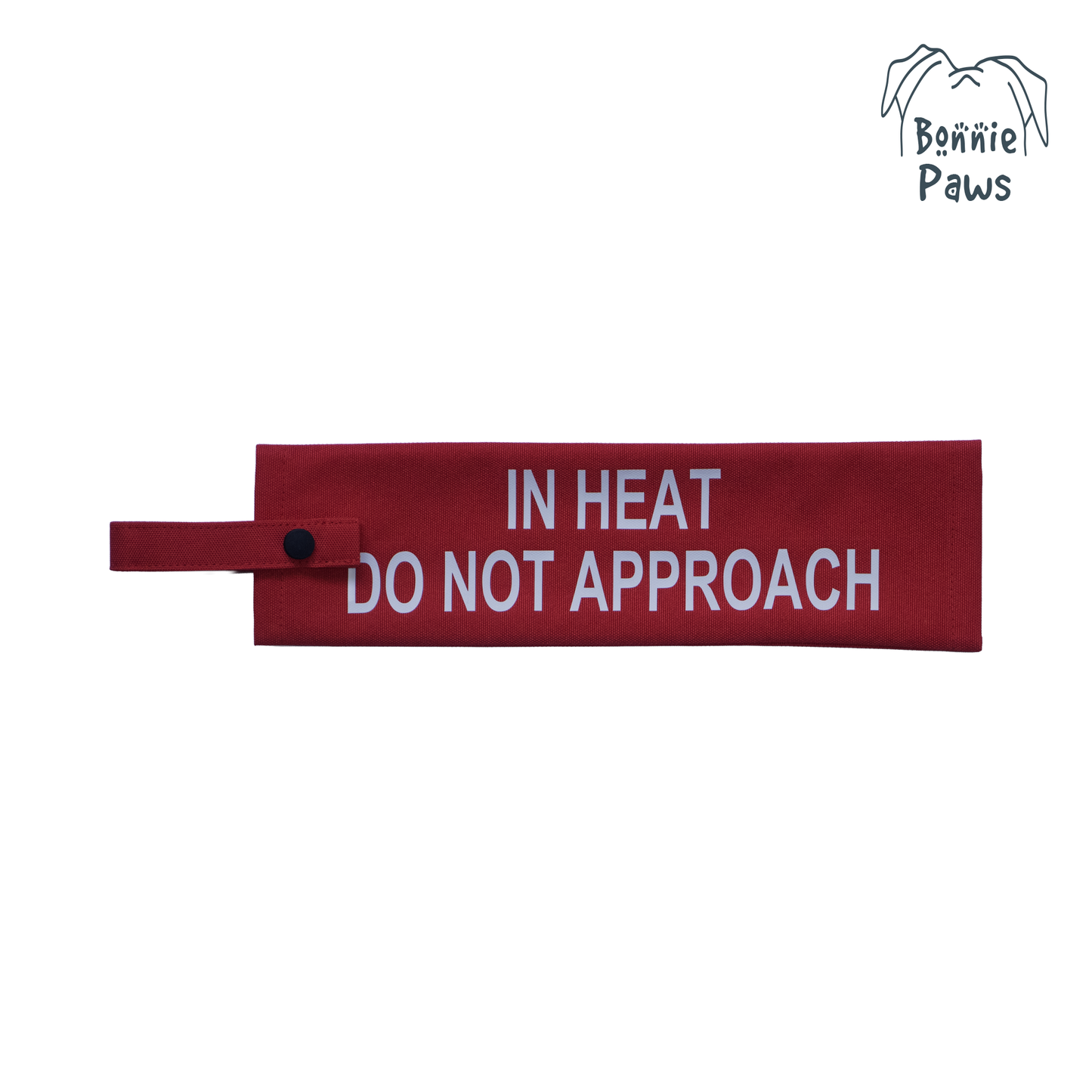 Flat lay view of a red waterproof dog warning sleeve with bold white DO NOT APPROACH lettering
