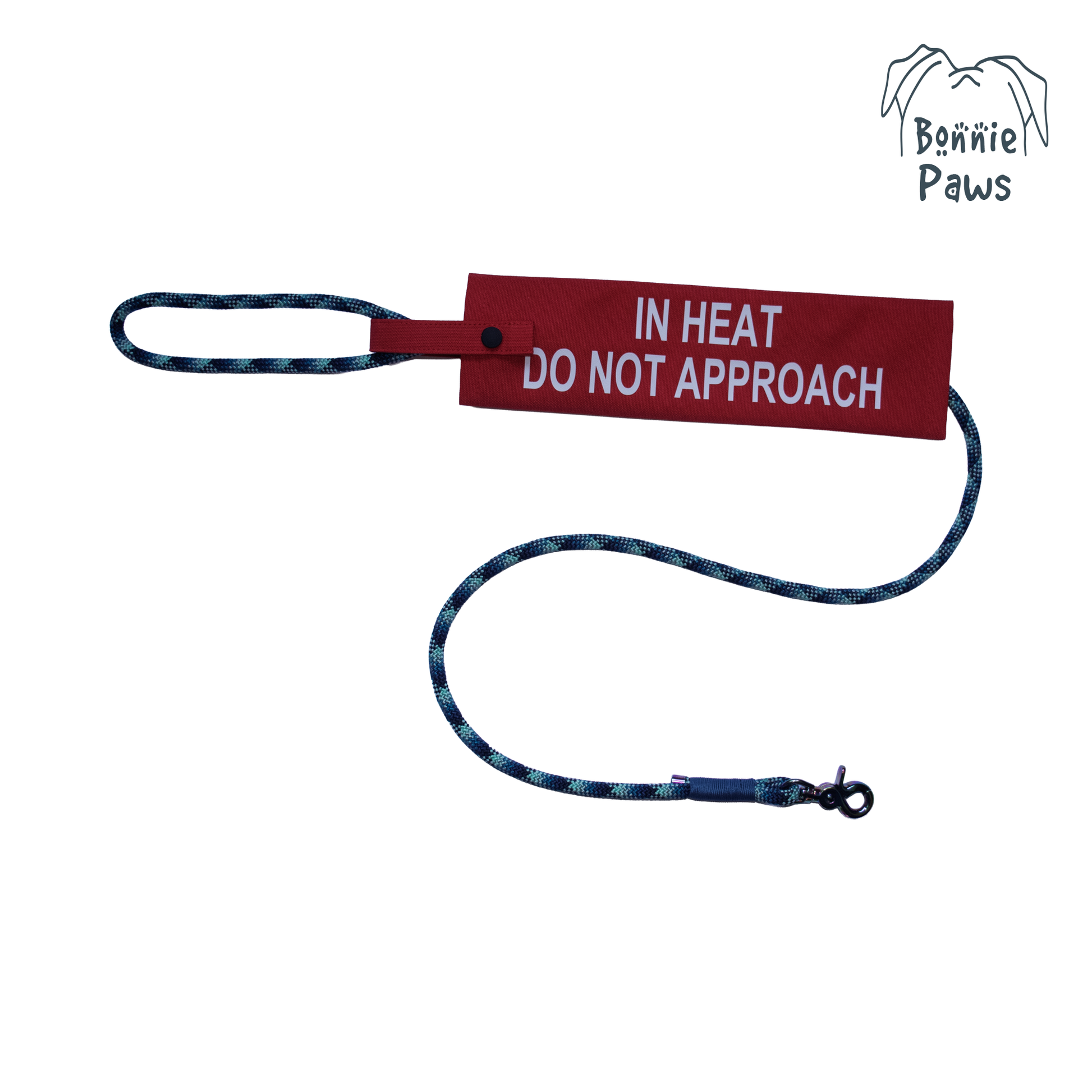 Red "In Heat" dog lead sleeve with "DO NOT APPROACH" text and Bonnie Paws logo on a lead.