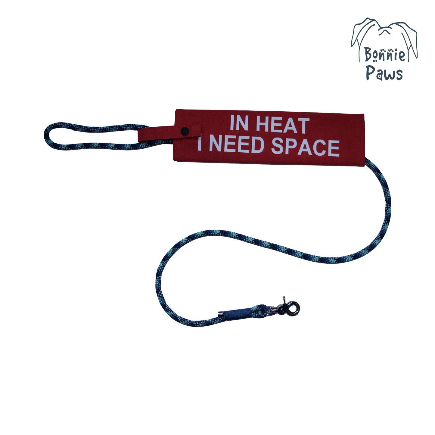 "In Heat" dog lead sleeve with "I NEED SPACE" text and Bonnie Paws logo on a lead.