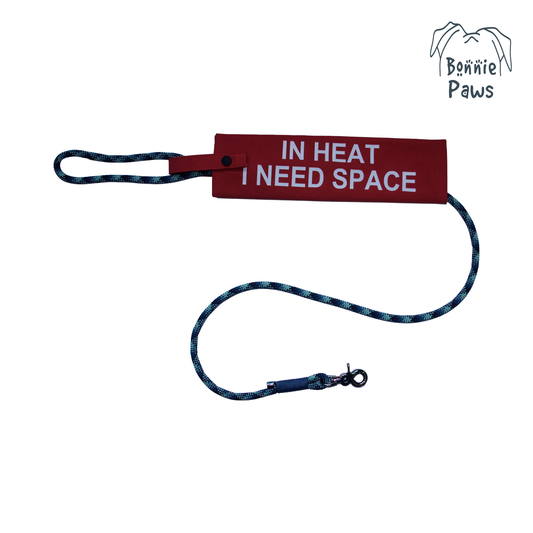 "In Heat" dog lead sleeve with "I NEED SPACE" text and Bonnie Paws logo on a lead.